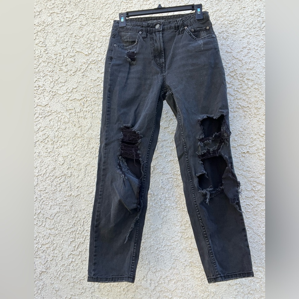 Very ripped black fitted straight leg boyfriend jeans